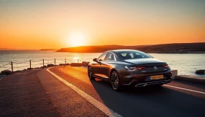 Experience luxury hire chauffeur Malta with a stylish car against a breathtaking sunset backdrop.